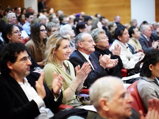 People clapping in lecture